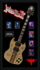 Signed guitar with band photos and logo.
