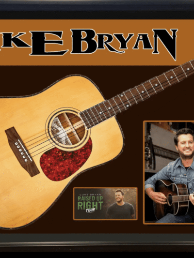 Signed guitar with musician photos and name.