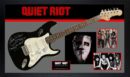 Quiet Riot guitar with band images displayed.