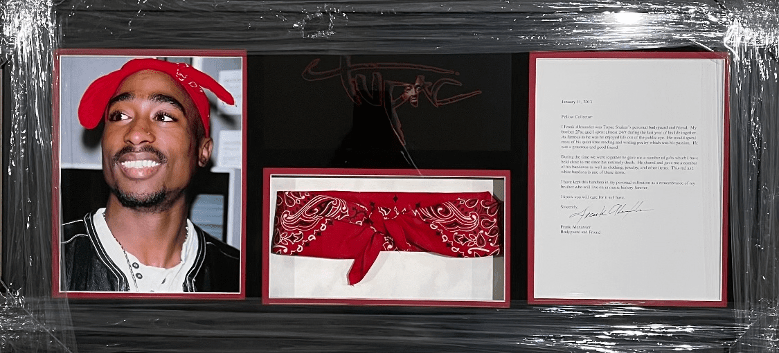 Framed memorabilia with photo and bandana.