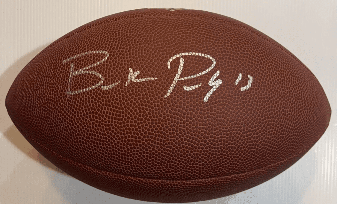 Autographed football with signature in silver ink.