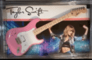 Pink guitar with artist's signature and photo.