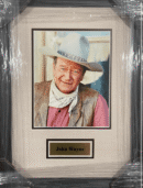 Framed portrait of a man in cowboy attire.