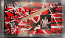 Red and white striped electric guitar display.