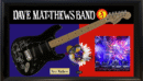 Electric guitar with band and concert imagery.