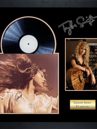 Framed album display with guitar and portraits.