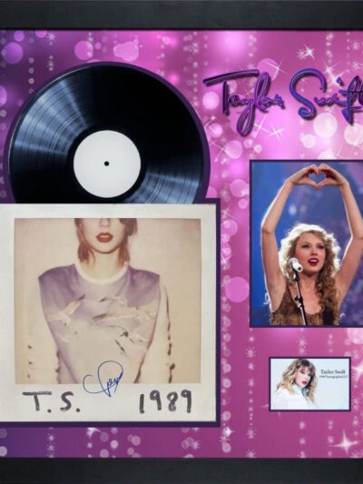 Framed album display with singer's memorabilia.