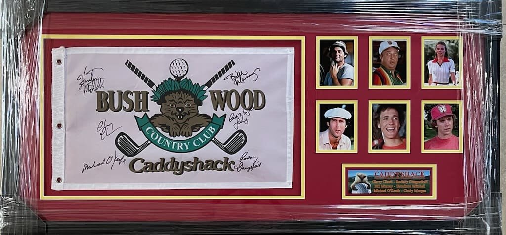 Caddyshack memorabilia with autographs and photos.