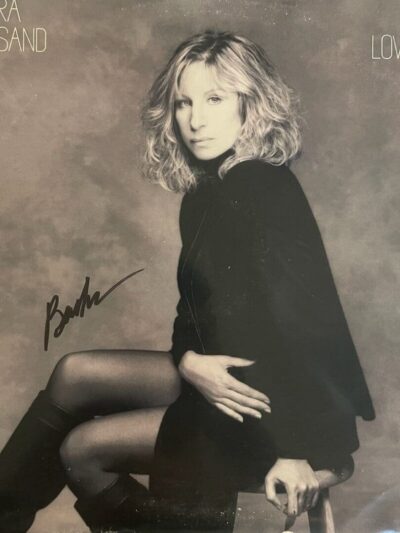Black-and-white seated woman portrait with autograph
