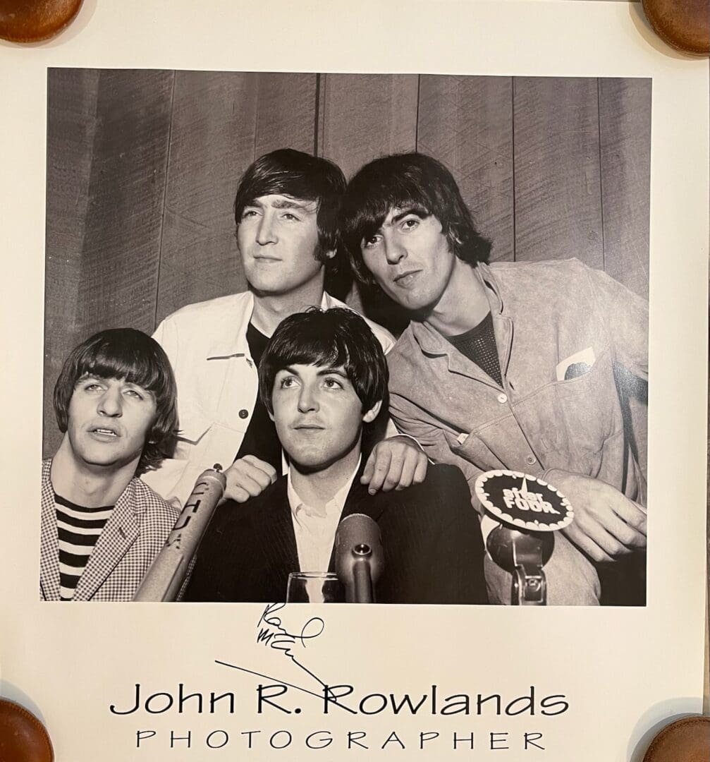 Four men posing for a vintage portrait.