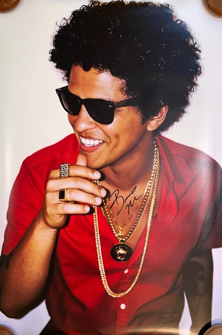 Man in red shirt wearing sunglasses