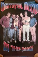 Band members in "In the Dark" poster.