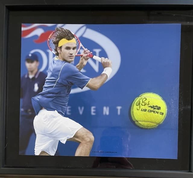 Tennis player hitting ball at US Open.