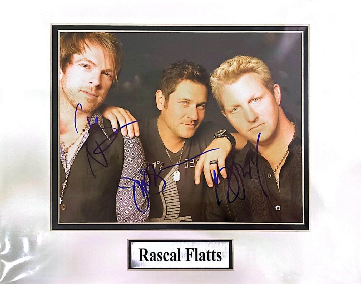 Three men with autographs