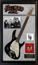 Framed Fleetwood Mac guitar and memorabilia display.