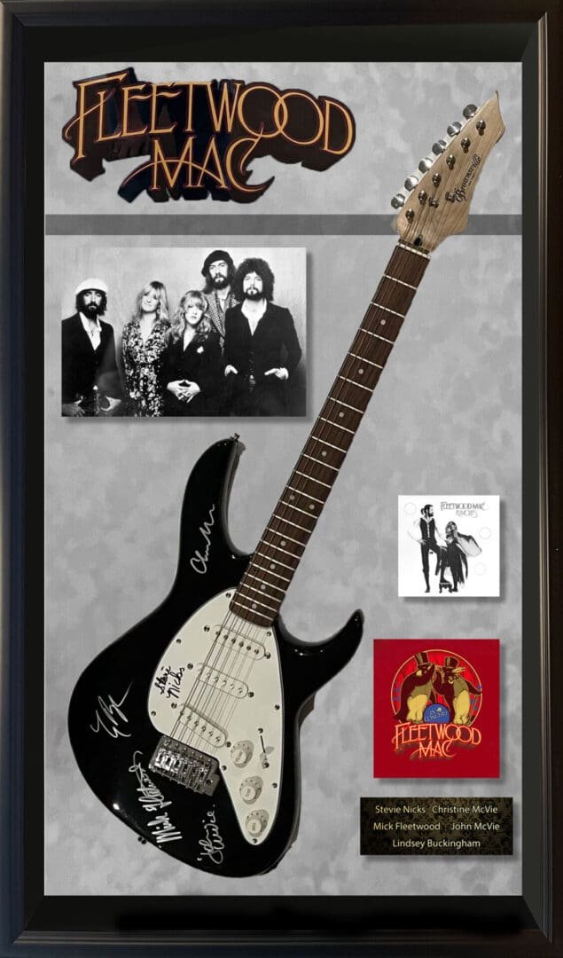 Framed Fleetwood Mac guitar and memorabilia display.