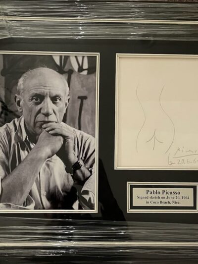 Framed photo and sketch of an artist.