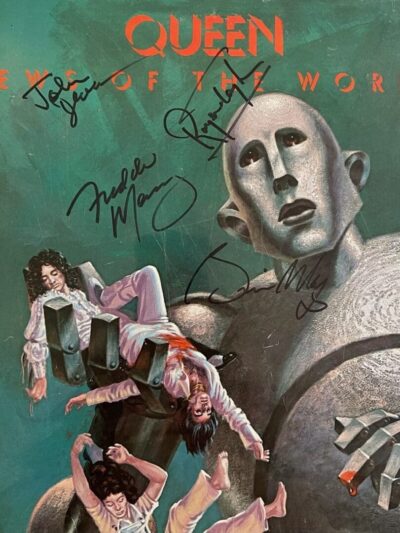 Autographed vintage album cover: giant robot holding people