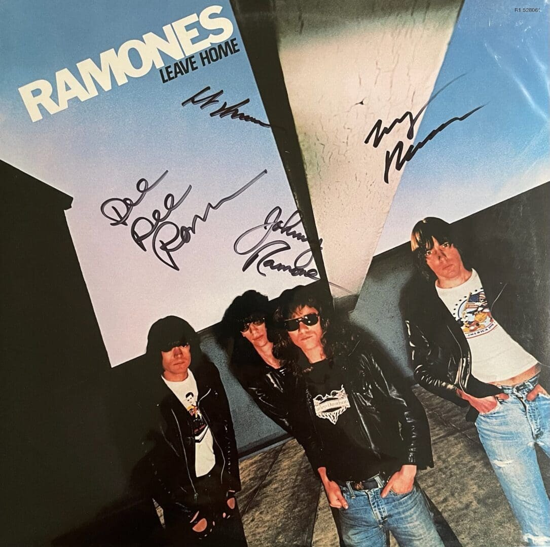 Autographed punk album cover with four band members