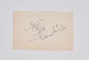 Autograph on a plain beige card.