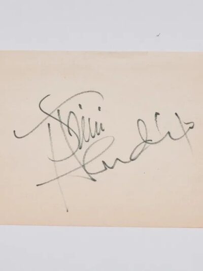Autograph on a plain beige card.