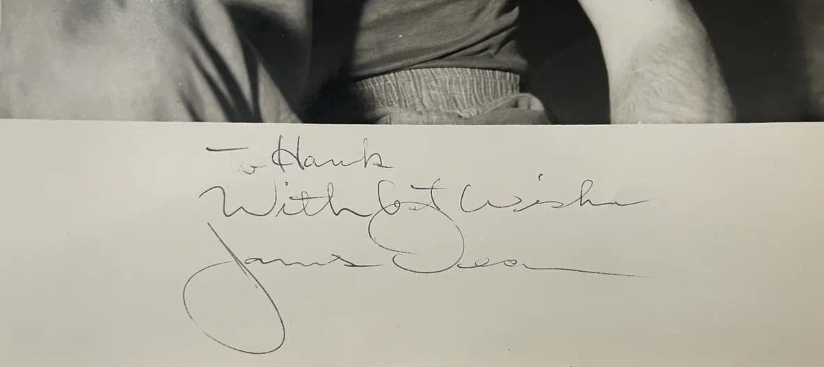 Handwritten dedication and signature on photograph.