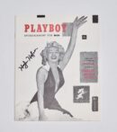 Magazine cover with woman in swimsuit.