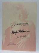 Autographed photo of a woman with signatures.