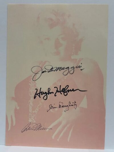 Autographed photo of a woman with signatures.
