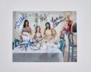 Five women sitting at a table