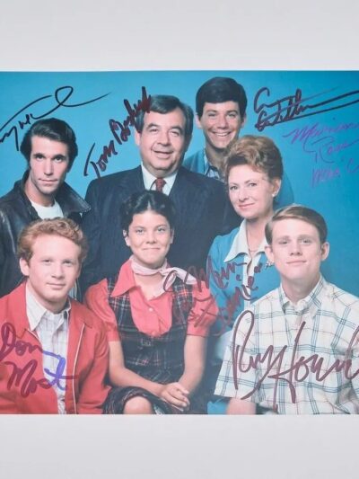 Group portrait of people with autographs.