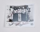 Black-and-white photo of five men signed.