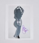 Woman posing in fishnet tights