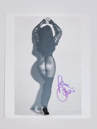 Woman posing in fishnet tights