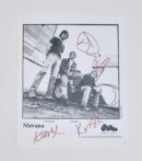 Signed Nirvana band photo with three members.