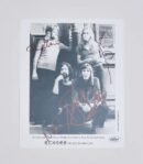 Black and white band photo with signatures.