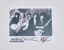 Black and white band photo with signatures.
