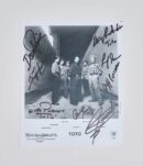 Black and white signed photo of a band.