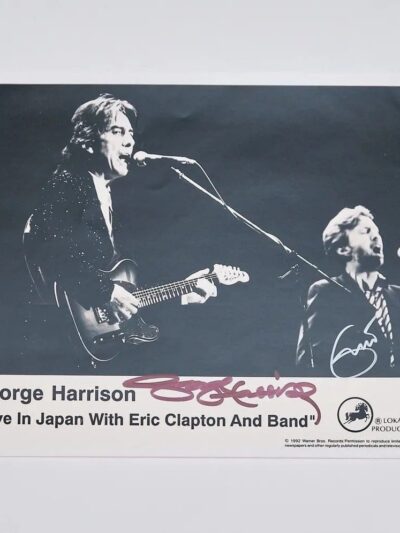 George Harrison performing live with Eric Clapton.