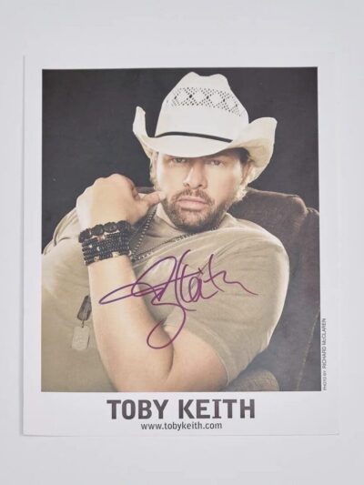 Man in cowboy hat with signature.