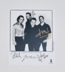 Black-and-white band photo with signatures.