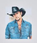 Man in cowboy hat and denim shirt.