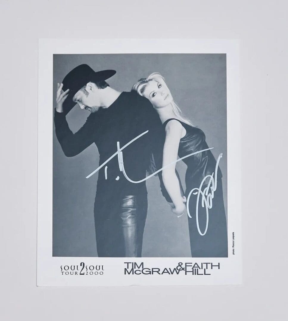 Signed promotional photo of a musical duo.