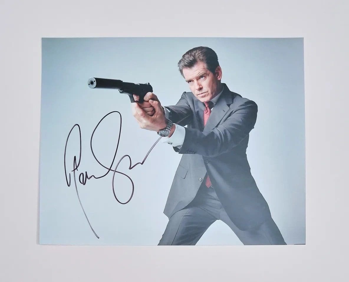 Man in suit aiming gun