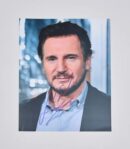 Autographed portrait of a man in suit.