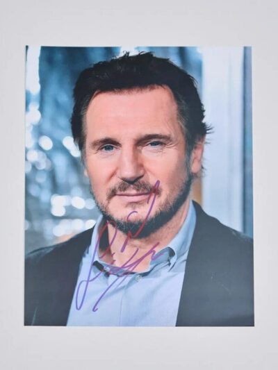 Autographed portrait of a man in suit.