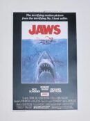 Jaws movie poster with shark illustration.