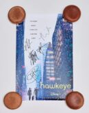 Hawkeye poster with signatures and city background.