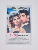 Grease movie poster with lead actors.