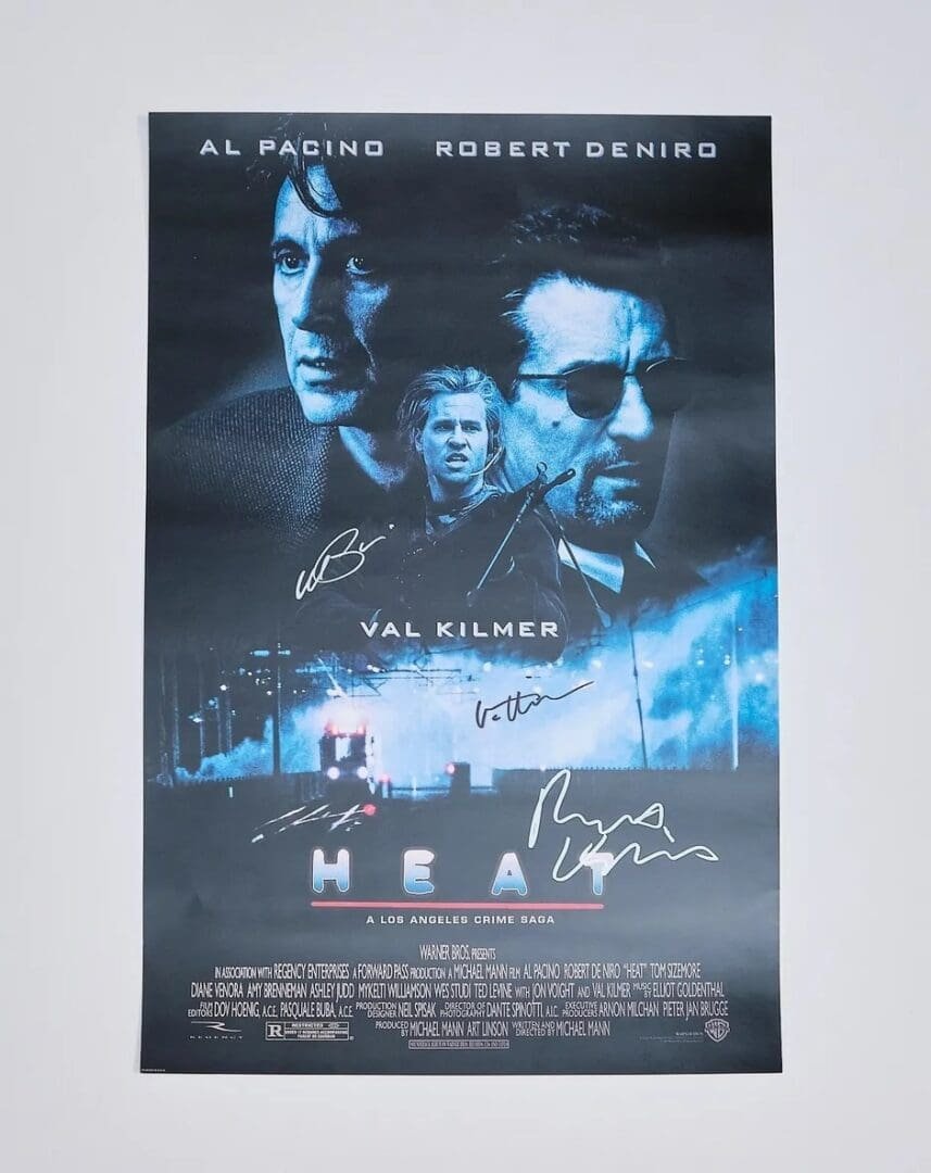 Movie poster with actor signatures.